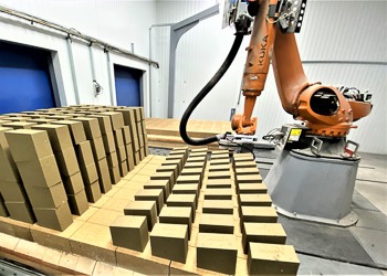 Robot depalletizes bricks in factory